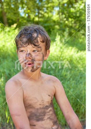 The child smeared the face, hands and body in the 57656984