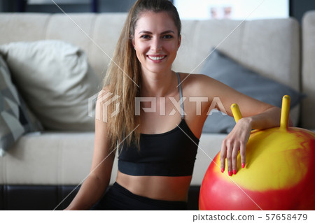 Smiling sporty woman Smiling sporty woman 57658479