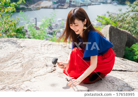 Young woman sightseeing onomichi 57658995