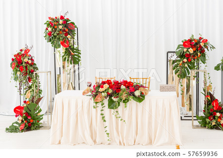 Red decor theme. Beautiful banquet a wedding reception. Interior of a wedding tent decoration ready 57659936