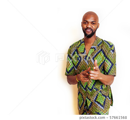 portrait of young handsome african man wearing bright green national costume smiling gesturing portrait of young handsome african man wearing bright green national costume smiling gesturing 57661568