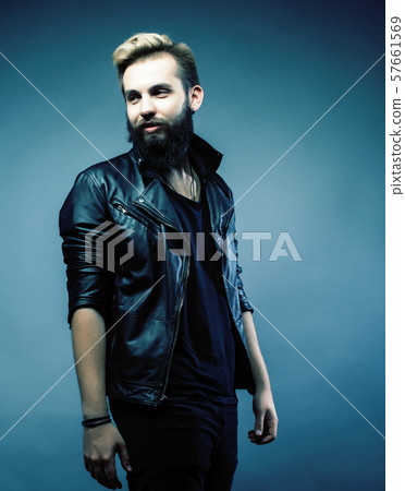 portrait of young bearded hipster guy smiling on gray background close up, lifestyle people concept portrait of young bearded hipster guy smiling on gray background close up, lifestyle people concept 57661569