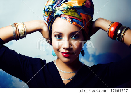 beauty bright african woman with creative make up, shawl on head like cubian closeup smiling beauty bright african woman with creative make up, shawl on head like cubian closeup smiling 57661727