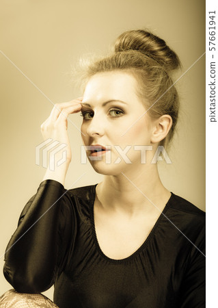 girl blonde woman in hair bun girl blonde woman in hair bun 57661941