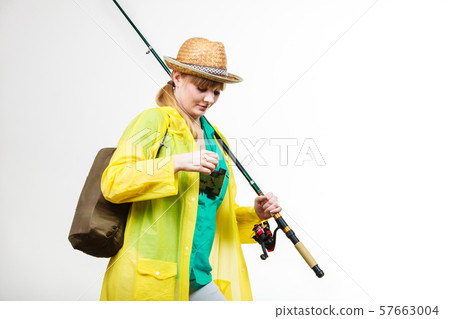 Woman with fishing rod, spinning equipment Woman with fishing rod, spinning equipment 57663004