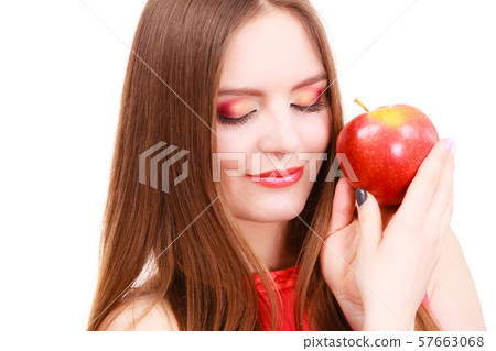 Woman charming girl colorful makeup holds apple Woman charming girl colorful makeup holds apple 57663068