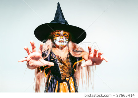 Little girl like a witch on white background Little girl like a witch on white background 57663414