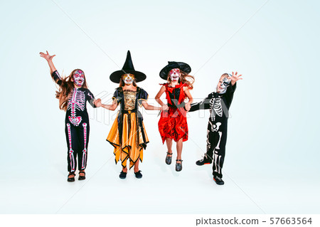 Kids or teens like witches and vampires on white background 57663564