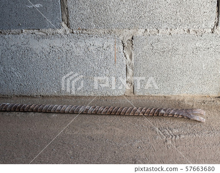 Old crowbar on the concrete floor. 57663680