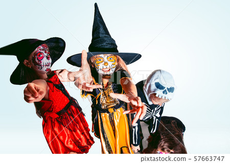 Kids or teens like witches and vampires on white background Kids or teens like witches and vampires on white background 57663747
