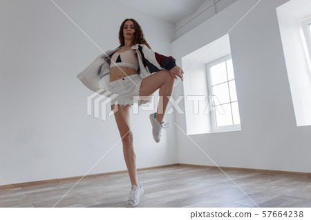 Attractive young woman dancer in sportswear 57664238