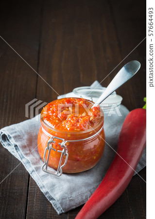 Traditional adjika hot chili pepper sauce paste Traditional adjika hot chili pepper sauce paste 57664493
