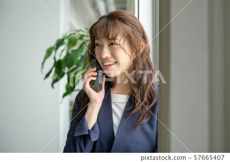Young woman making a phone call 57665407