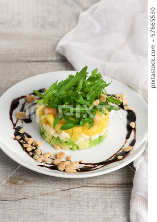 Salad with avocado, mango and mozzarella Salad with avocado, mango and mozzarella 57665530