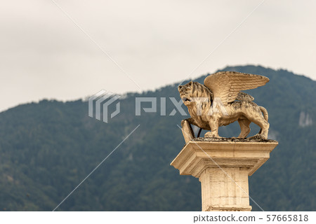 Winged lion of St Mark - Symbol of the Venetian Republic - Piazza Maggiore Feltre Italy Winged lion of St Mark - Symbol of the Venetian Republic - Piazza Maggiore Feltre Italy 57665818