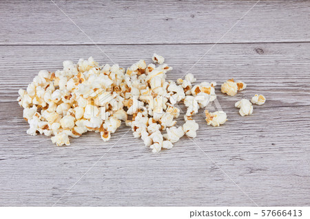 Popcorn on wooden background 57666413