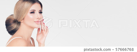 Beautiful woman face. Healthy hair and clear skin. 57666768