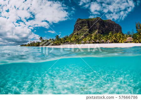 Tropical crystal ocean with Le Morne mountain and luxury beach in Mauritius. Split view. Tropical crystal ocean with Le Morne mountain and luxury beach in Mauritius. Split view. 57666786