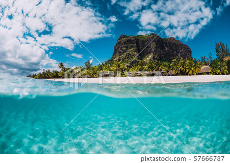 Tropical crystal ocean with Le Morne mountain and luxury beach in Mauritius. Split view. Tropical crystal ocean with Le Morne mountain and luxury beach in Mauritius. Split view. 57666787