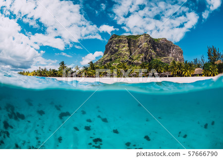 Tropical crystal ocean with Le Morne mountain and luxury beach in Mauritius. Split view. Tropical crystal ocean with Le Morne mountain and luxury beach in Mauritius. Split view. 57666790