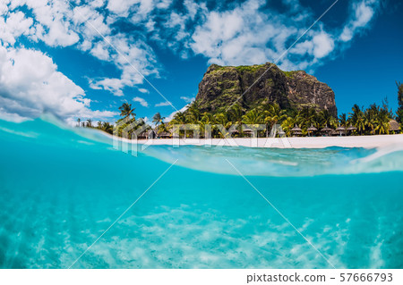 Tropical crystal ocean with Le Morne mountain and luxury beach in Mauritius. Split view. Tropical crystal ocean with Le Morne mountain and luxury beach in Mauritius. Split view. 57666793