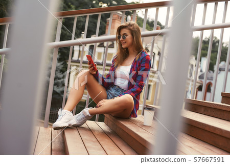 Beautiful girl relaxing in the summer city 57667591