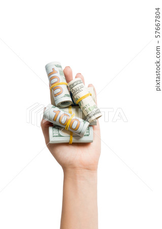 Top view of rolled up in tubes dollar bills in 57667804