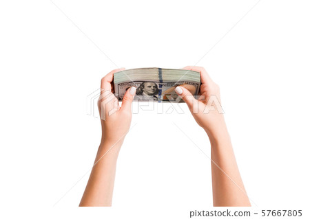 Top view of a bundle of money in female hands. 57667805