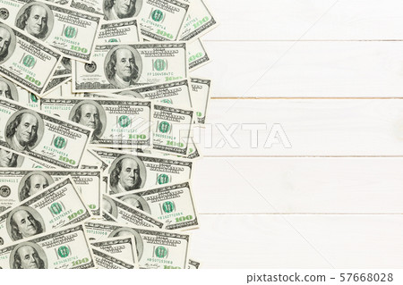 One hundred dollar banknotes on colored background One hundred dollar banknotes on colored background 57668028