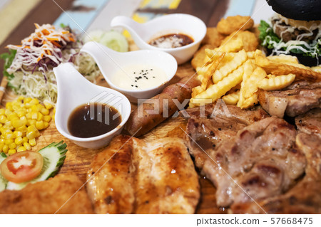 Fast food concept with greasy grill fried  57668475