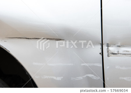 Car have scratched with deep damage to the paint,car accident on the road. 57669034