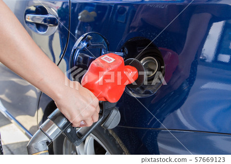 Women who refuel at the self stand 57669123