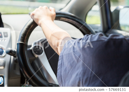 Young woman driving 57669131