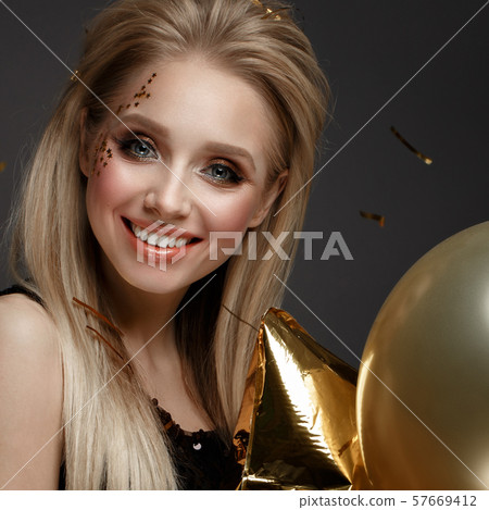 Beautiful young girl in elegant evening dress with festive balloons. Beauty face. Beautiful young girl in elegant evening dress with festive balloons. Beauty face. 57669412