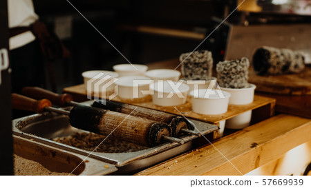 Cooking of trdelniks on the grill at the point of sale Cooking of trdelniks on the grill at the point of sale 57669939