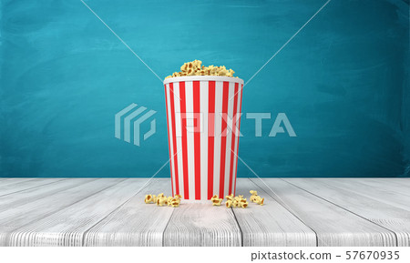 3d rendering of popcorn bucket on wooden surface near blue wall with copy space. 3d rendering of popcorn bucket on wooden surface near blue wall with copy space. 57670935