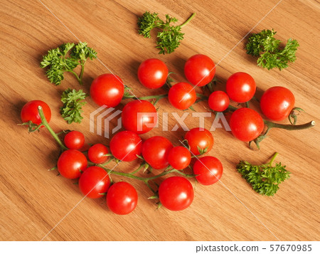 cherry tomatoes on a wooden table 57670985