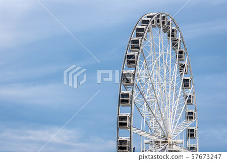 Panoramic wheel on a light blue sky background. 57673247