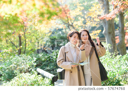 Travel autumn autumn leaves mother daughter parent and child family travel image 57674768