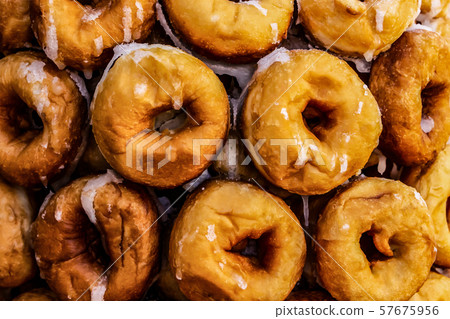 Many sweet donuts pyramid folded. texture donuts Many sweet donuts pyramid folded. texture donuts 57675956