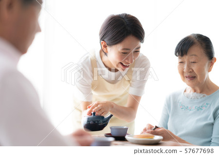 Three people three people meal nursing home at home lifestyle old man interior design room white natural light 57677698