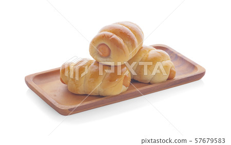 Fresh hot crusty bread rolls. Sausages in dough 57679583