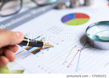 Close up pen on the financial chart with statistics  57680201