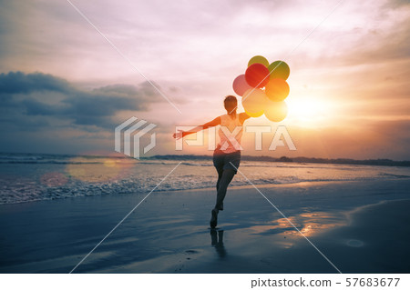 young asian woman running and jumping on seaside young asian woman running and jumping on seaside 57683677