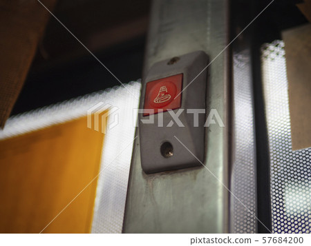 low angle of red stop button on bangkok bus 57684200
