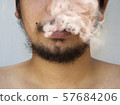 messy bearded man with white smoke from mouth onto 57684206