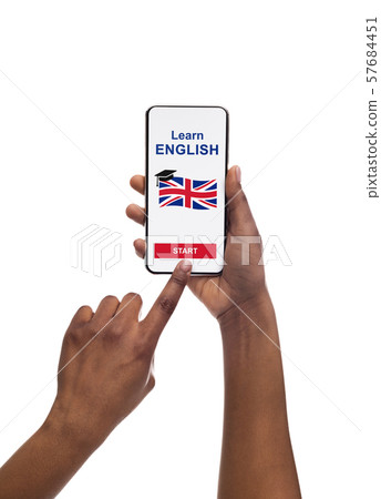 Black Female Downloading App For Learning English Language On Smartphone. 57684451