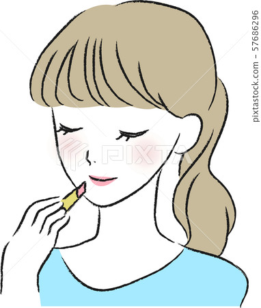 A woman applying lipstick A woman applying lipstick 57686296