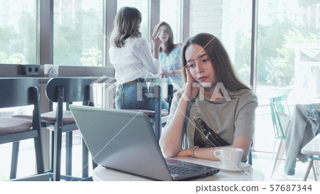 Young woman stressing out while working on laptop at the coffee shop 57687344