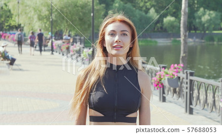 Happy healthy woman enjoying running outdoors 57688053